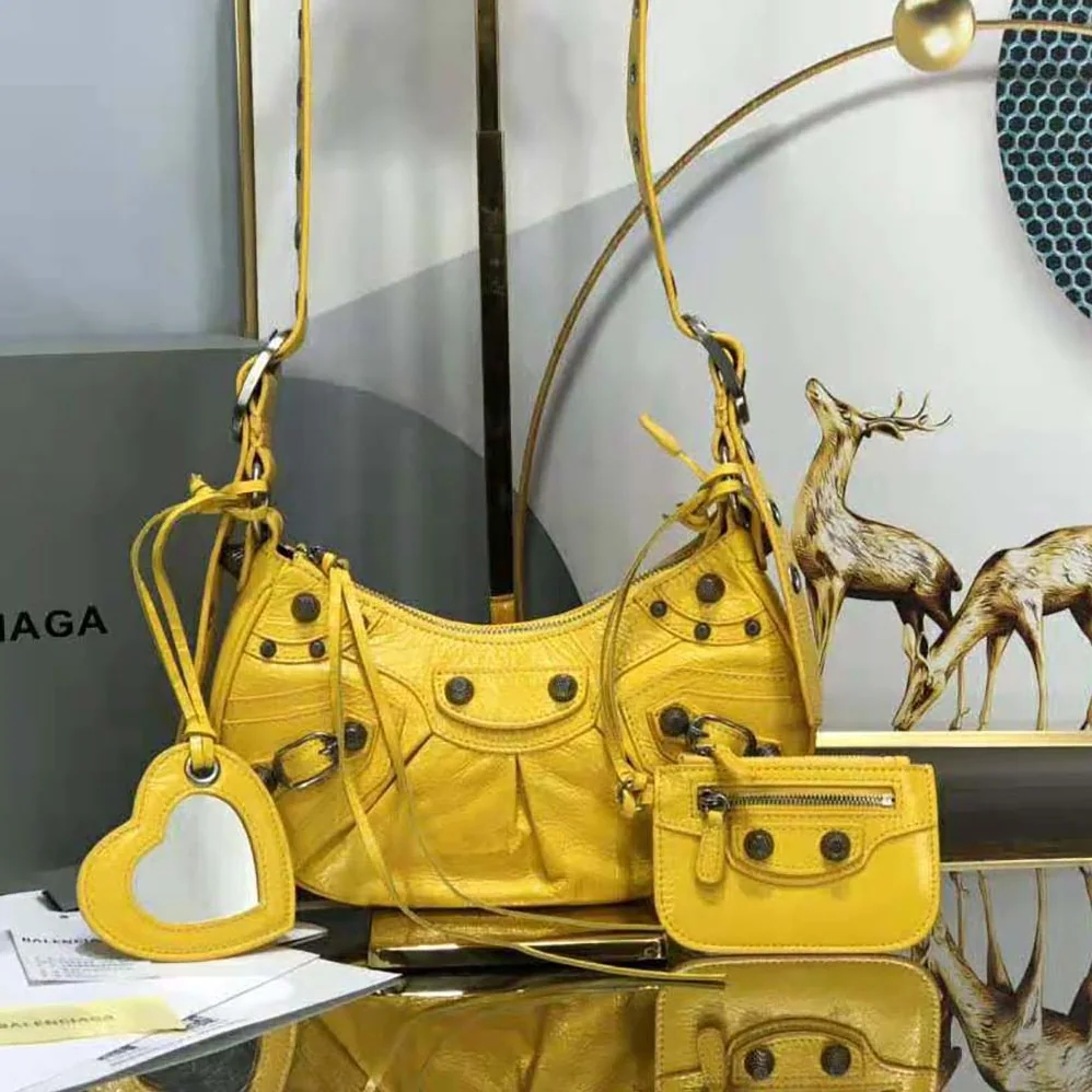Balenciaga Le Cagole XS Shoulder Bag in Yellow for Women Balenciaga Le Cagole XS Shoulder Bag in Yellow for Women