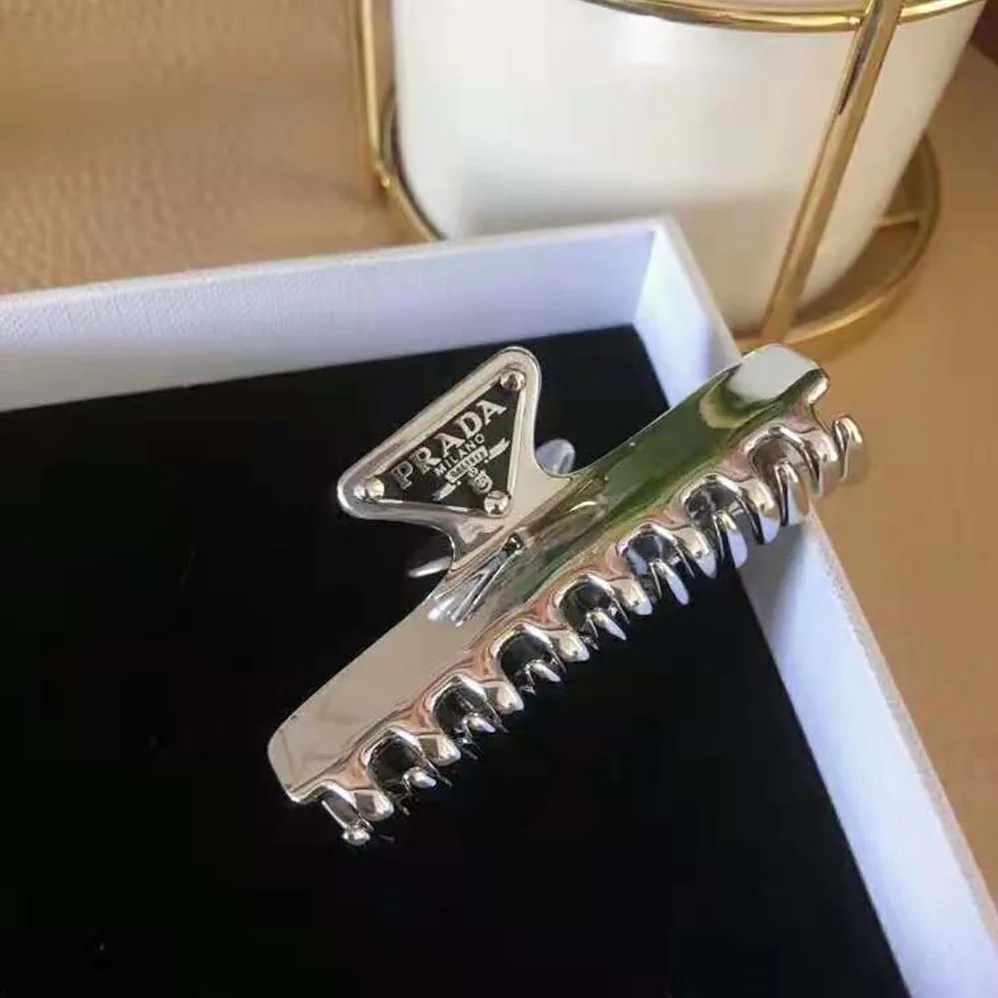 Prada Metal Hair Clip with Sophisticated and Versatile Allure for Women Prada Metal Hair Clip with Sophisticated and Versatile Allure for Women