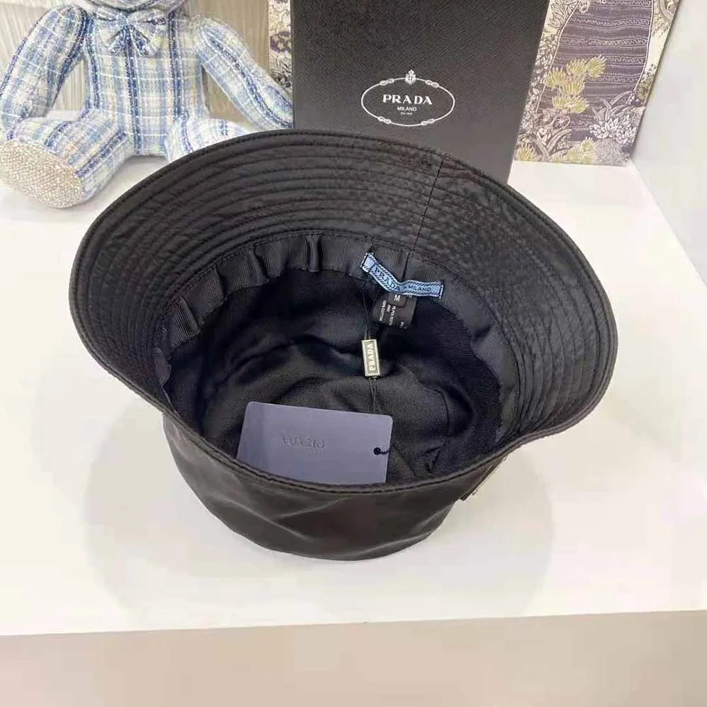 Prada Nylon Bucket Hat Decorated with the Triangle Logo for Women in Black Prada Nylon Bucket Hat Decorated with the Triangle Logo for Women in Black