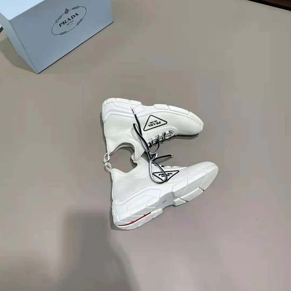 Prada The Triangle Logo Decorates These Knit Fabric Sneakers for Women in White Prada The Triangle Logo Decorates These Knit Fabric Sneakers for Women in White