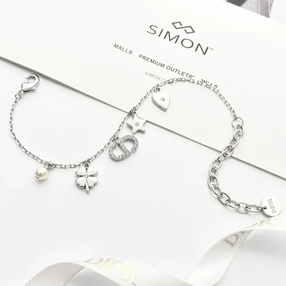 Dior Petit CD Lucky Charms Bracelet Silver-Finish Metal with White Resin Pearl and Silver for Women in Tone Crystals Dior Petit CD Lucky Charms Bracelet Silver-Finish Metal with White Resin Pearl and Silver for Women in Tone Crystals