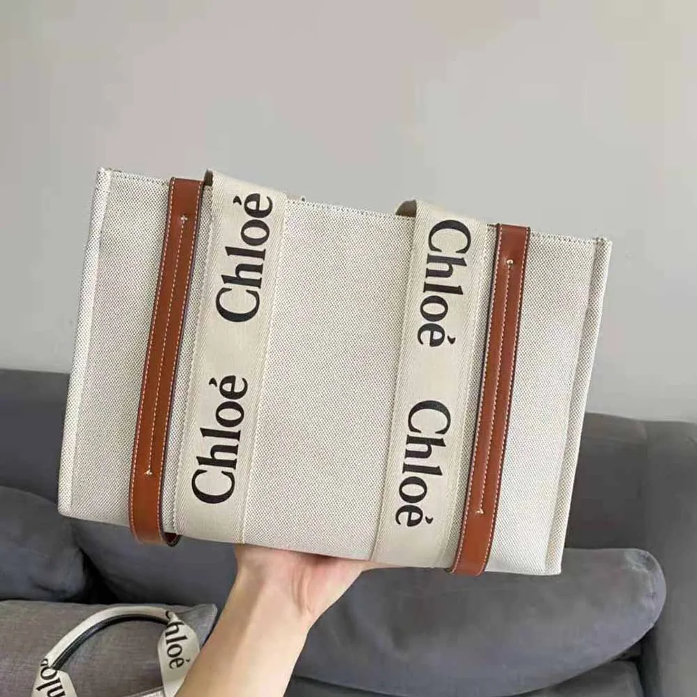 Chloe Large Woody Tote Bag in Linen Canvas and Shiny Calfskin with Woody Ribbon for Women Chloe Large Woody Tote Bag in Linen Canvas and Shiny Calfskin with Woody Ribbon for Women