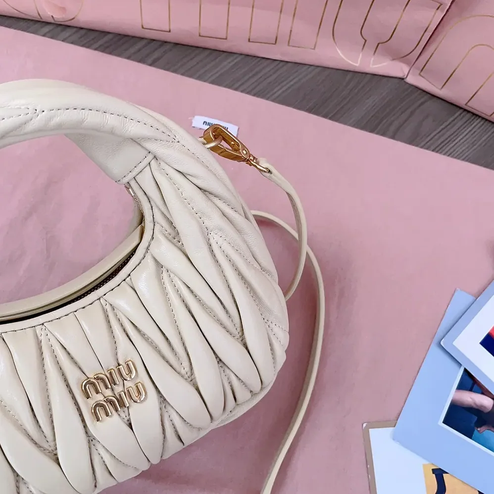 Miu Miu Wander Matelassé Nappa Leather Hobo Mini-Bag for Women in Light Yellow Miu Miu Wander Matelassé Nappa Leather Hobo Mini-Bag for Women in Light Yellow