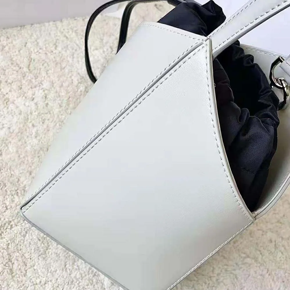Givenchy Mini Cut Out Bucket Bag in Box Leather for Women in White Givenchy Mini Cut Out Bucket Bag in Box Leather for Women in White