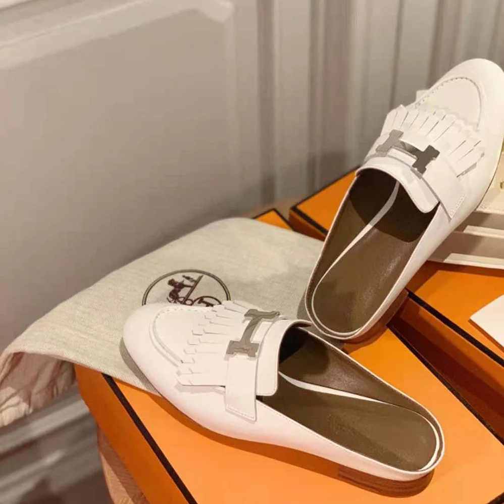 Hermes Rivoli Mule Mule in Calfskin with Fringe Detail for Women in White Hermes Rivoli Mule Mule in Calfskin with Fringe Detail for Women in White