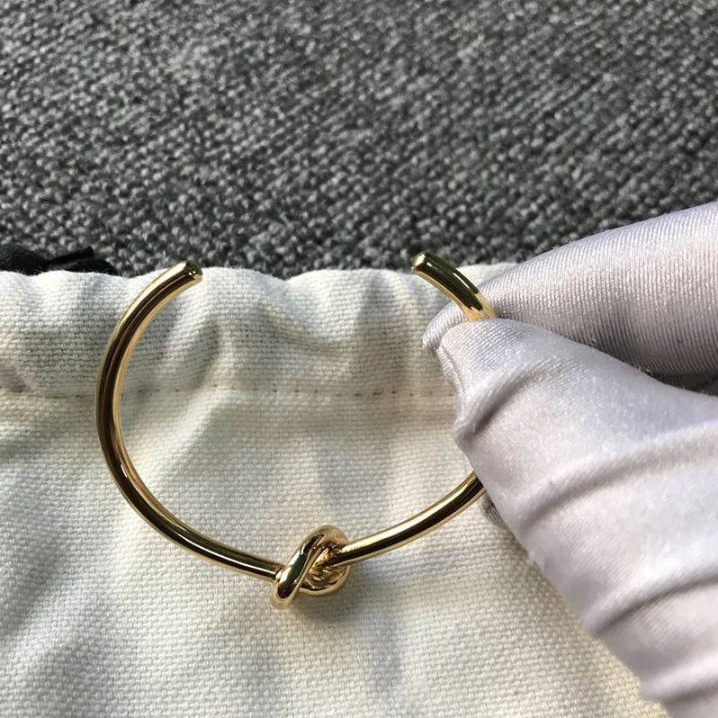 Celine Knot Extra-Thin Bracelet in Brass with Rhodium Finish for Women in Gold