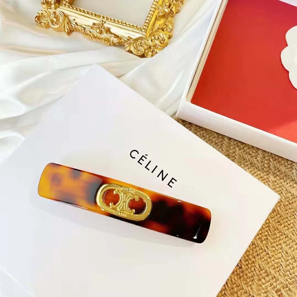 Celine Maillon Triomphe Hair Clip in Gold Brass Acetate and Steel for Women