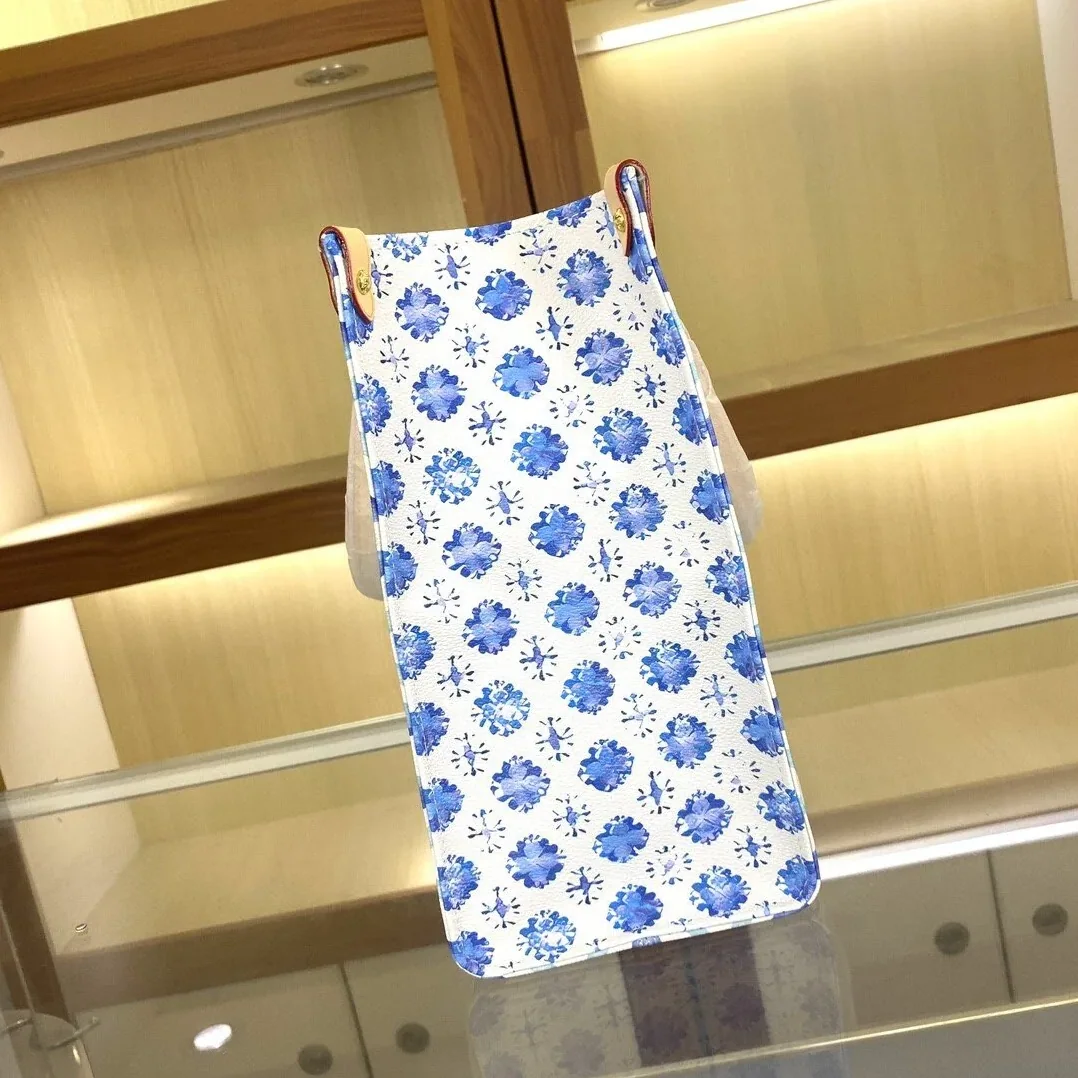 Louis Vuitton OnTheGo MM Tote Bag in Blue Gold Hardware