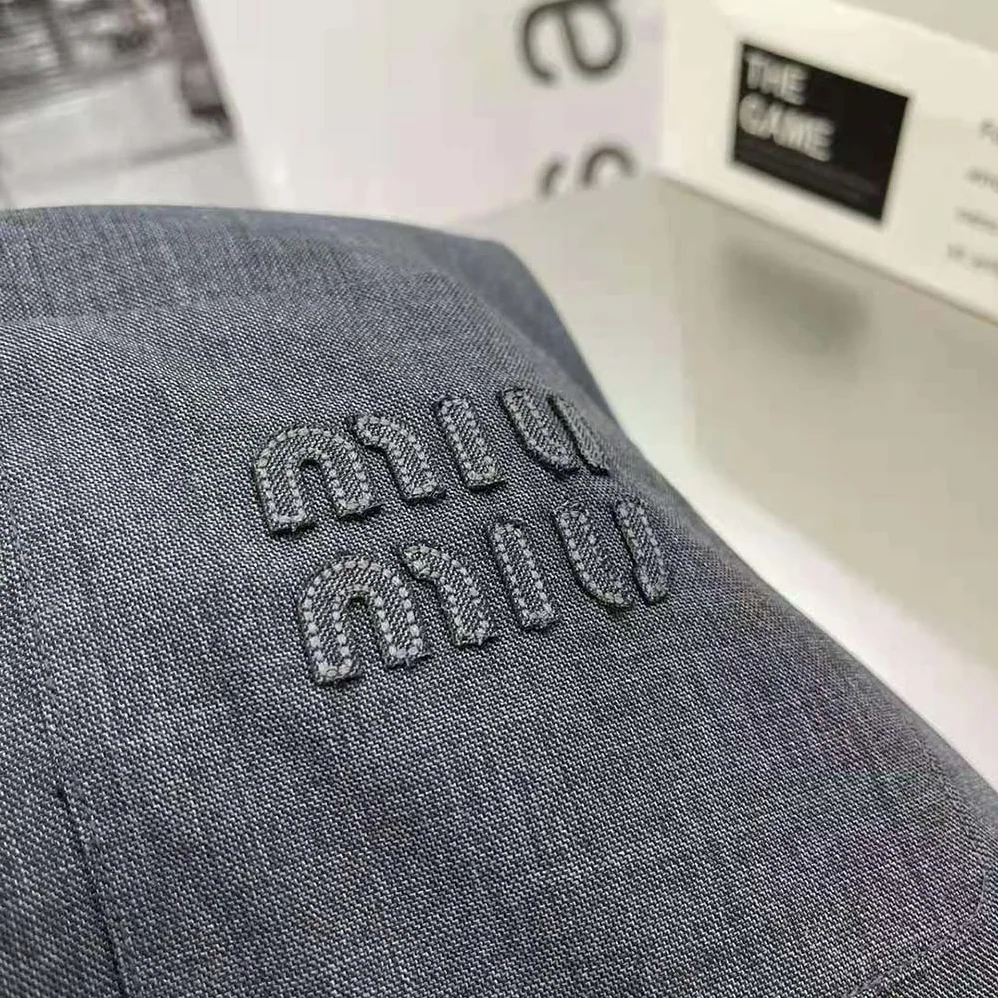 Miu Miu Grisaille Mini-Dress with Embroidered Logo for Women in Black Miu Miu Grisaille Mini-Dress with Embroidered Logo for Women in Black