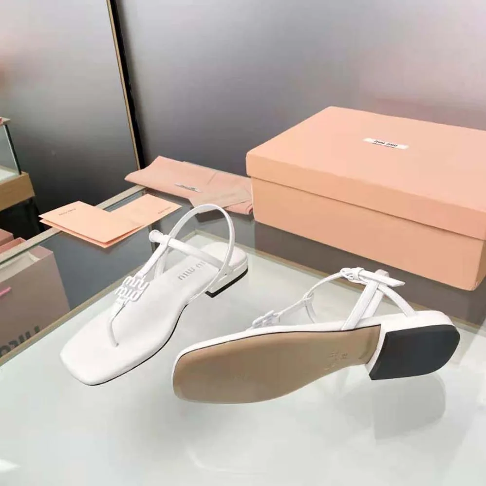 Miu Miu Patent Thong Sandals with Metal Lettering Logo for Women in White Miu Miu Patent Thong Sandals with Metal Lettering Logo for Women in White