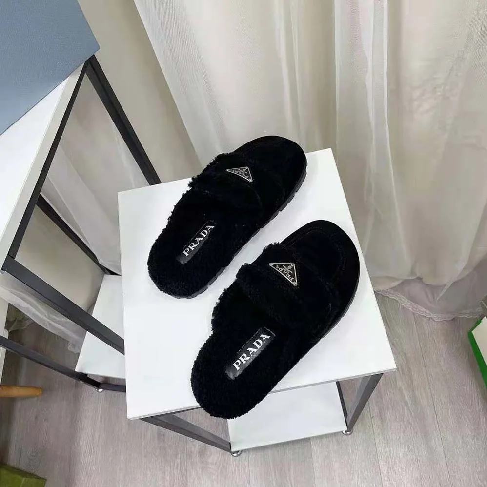 Prada Shearling Slippers Enameled Metal Triangle Logo for Women in Black