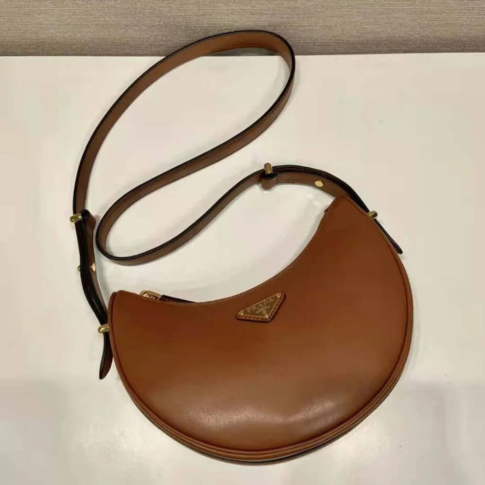 Prada Leather Shoulder Bag with Enameled Metal Triangle Logo for Women in Brown Prada Leather Shoulder Bag with Enameled Metal Triangle Logo for Women in Brown