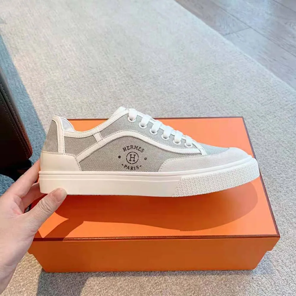Hermes Get Sneaker in SH Canvas and Calfskin with Signature “Hermès Paris” Stencil for Unisex in Silver Hermes Get Sneaker in SH Canvas and Calfskin with Signature “Hermès Paris” Stencil for Unisex in Silver
