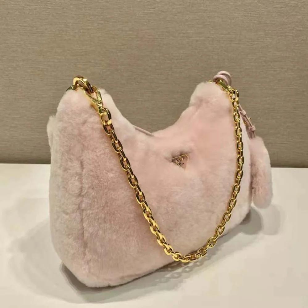 Prada Shearling Mini-Bag with the Enameled Metal Triangle Logo for Women in Pink Prada Shearling Mini-Bag with the Enameled Metal Triangle Logo for Women in Pink