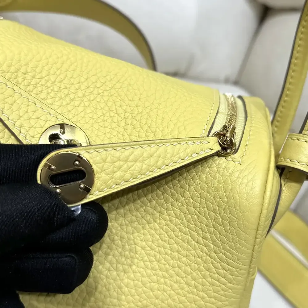 Hermes Lindy Mini 19 in Clemence Leather for Women in Yellow/Gold Hermes Lindy Mini 19 in Clemence Leather for Women in Yellow/Gold