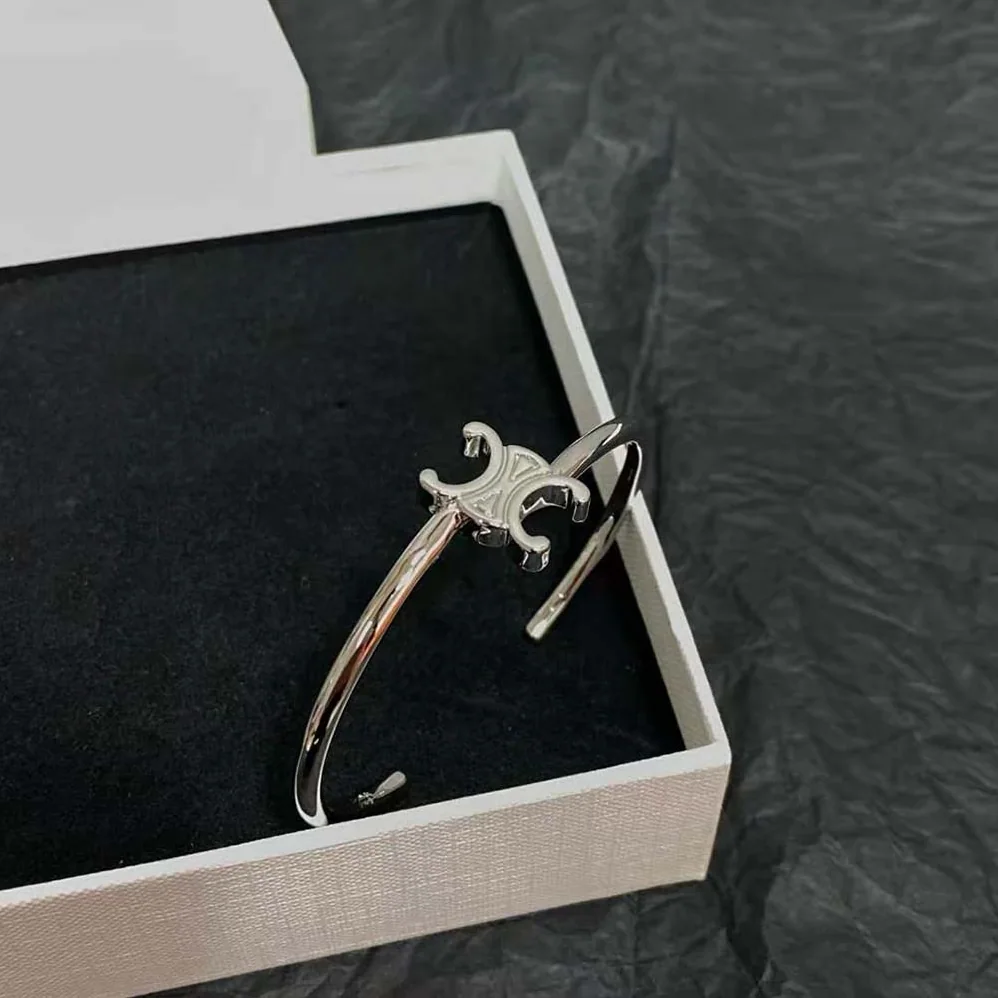 Celine Triomphe Asymmetric Cuff in Brass with Rhodium Finish for Women