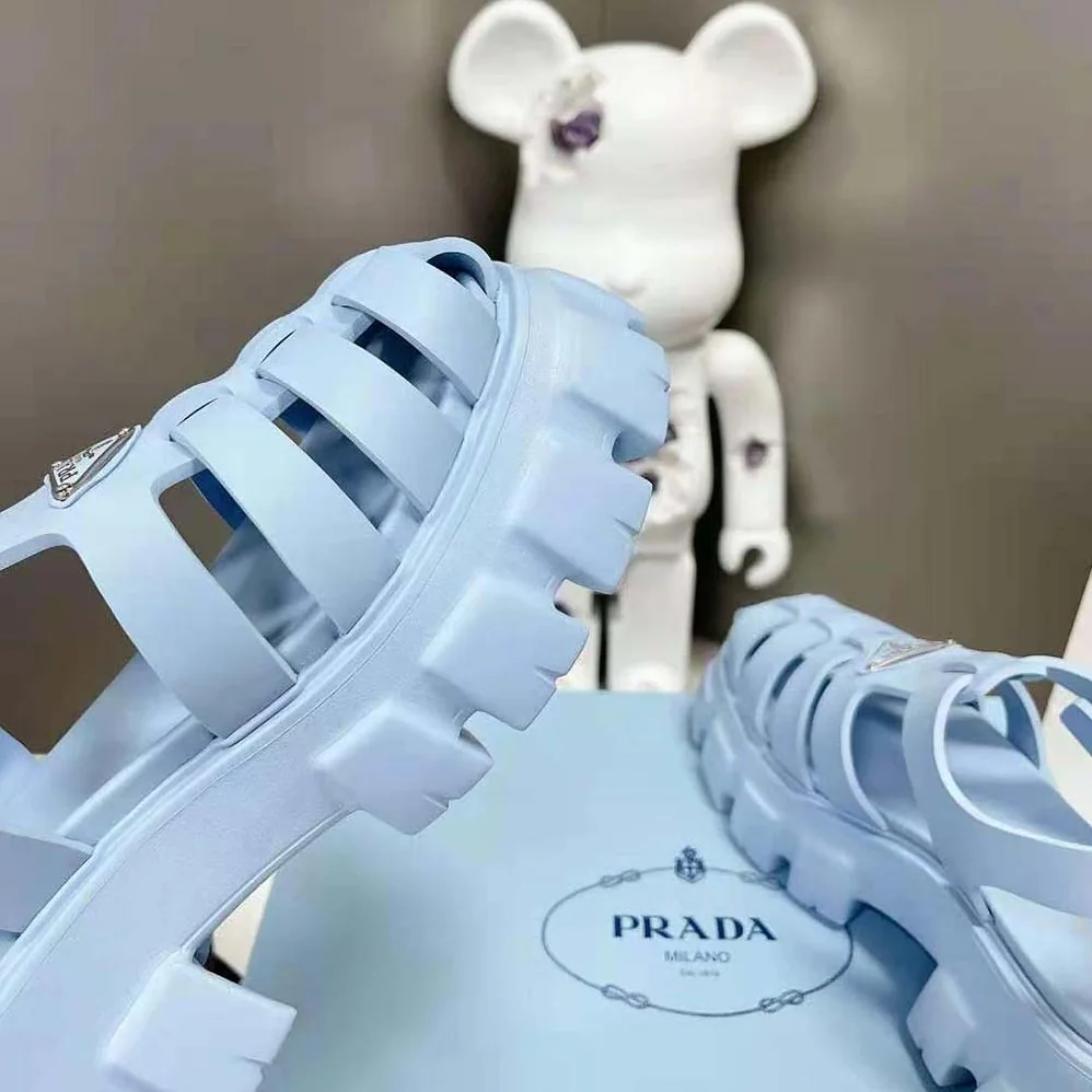 Prada Foam Rubber Sandals with Enameled Metal Triangle Logo for Women in Blue Prada Foam Rubber Sandals with Enameled Metal Triangle Logo for Women in Blue