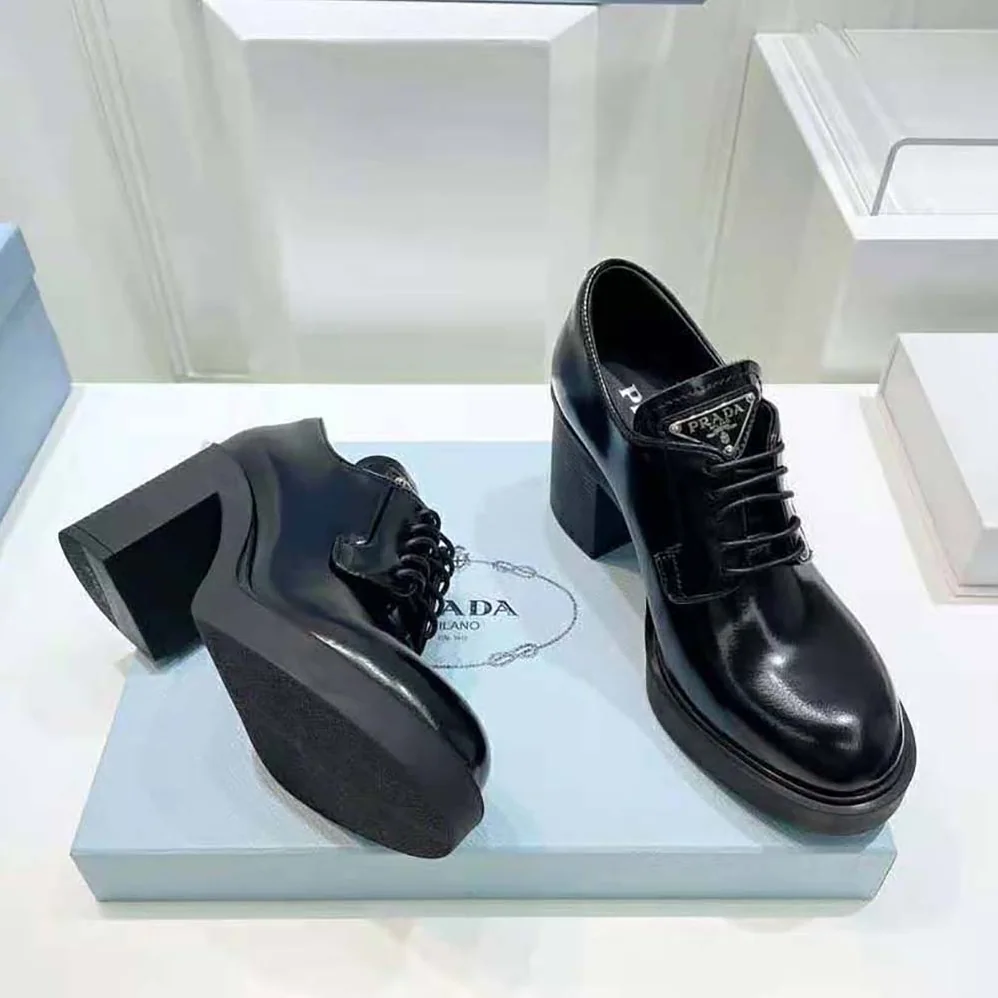 Prada Heeled Brushed Leather Lace-Ups for Women in Black Prada Heeled Brushed Leather Lace-Ups for Women in Black