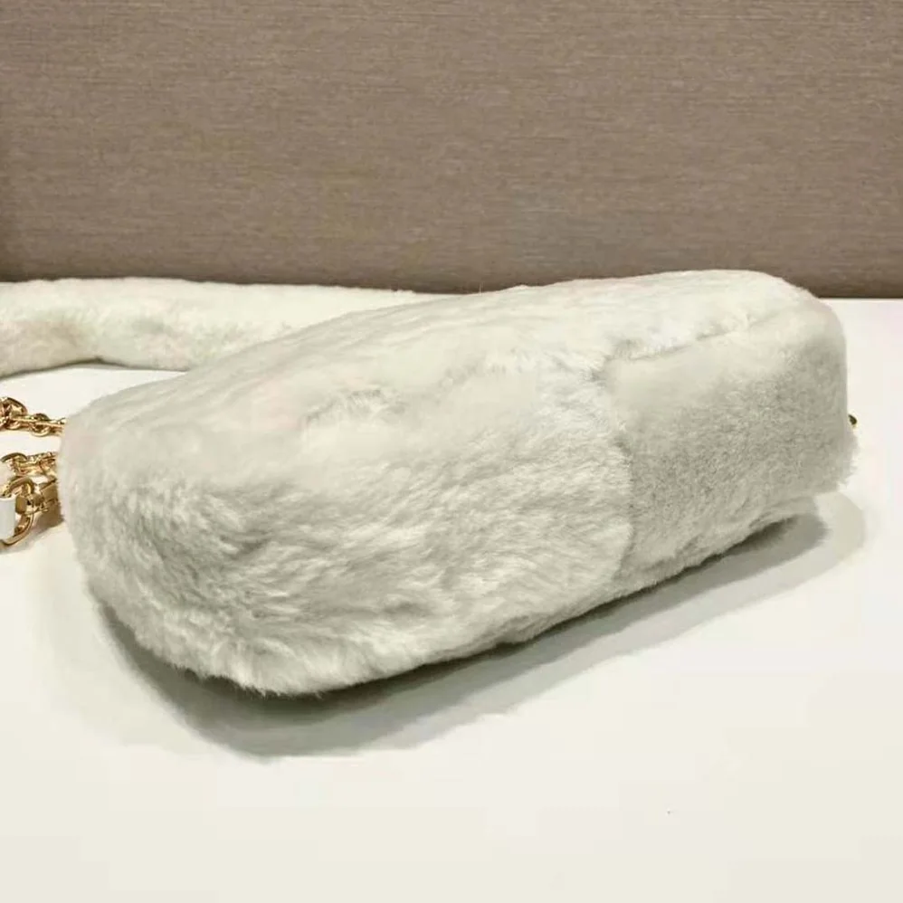 Prada Shearling Mini-Bag with the Enameled Metal Triangle Logo for Women in White Prada Shearling Mini-Bag with the Enameled Metal Triangle Logo for Women in White