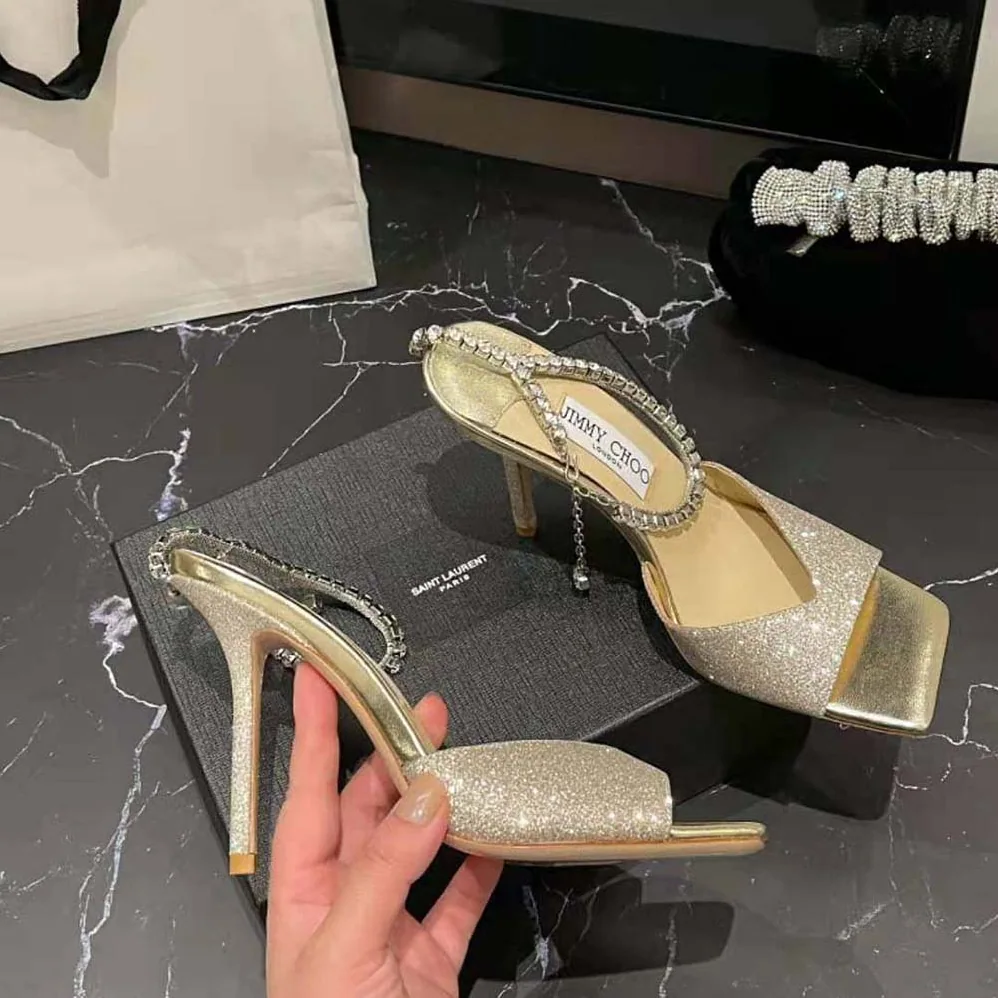 Jimmy Choo Saeda Sandal 100 Platinum Ice Dusty Glitter Sandals with Crystal Embellishment for Women Jimmy Choo Saeda Sandal 100 Platinum Ice Dusty Glitter Sandals with Crystal Embellishment for Women