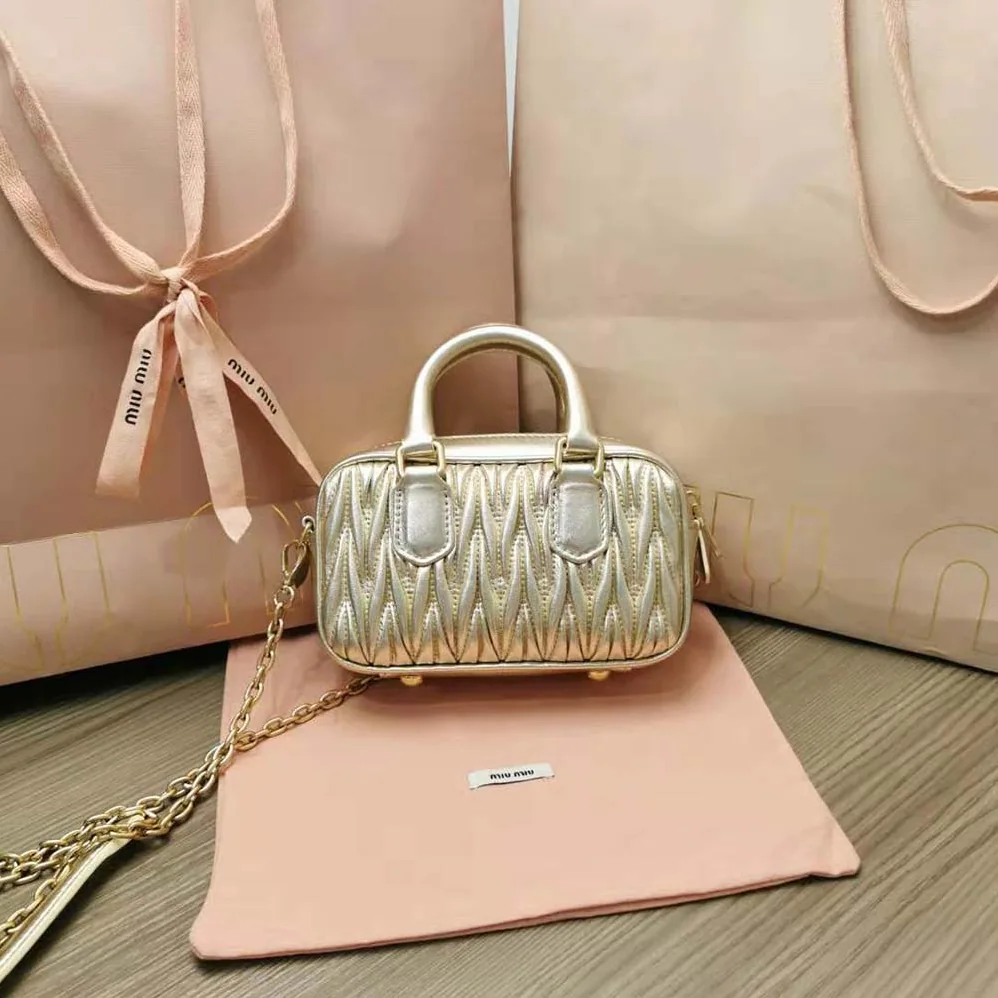 Miu Miu Matelassé Nappa Leather Top-Handle Mini-Bag for Women in Gold