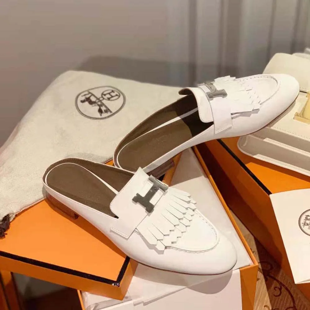 Hermes Rivoli Mule Mule in Calfskin with Fringe Detail for Women in White Hermes Rivoli Mule Mule in Calfskin with Fringe Detail for Women in White