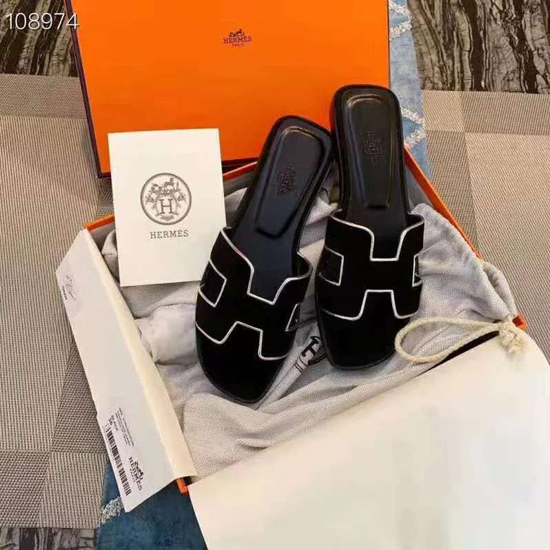Hermes Oran Sandal in Velvet and Nappa Leather with Metallic Finish and Iconic “H” Cut-Out for Women in Black Hermes Oran Sandal in Velvet and Nappa Leather with Metallic Finish and Iconic “H” Cut-Out for Women in Black