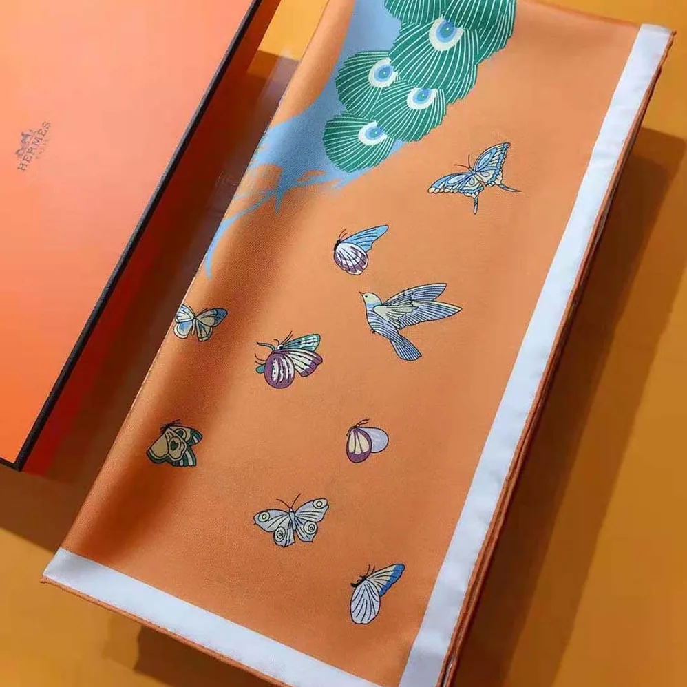 Hermes Hermes Story Scarf 90 in Silk Twill with Hand-Rolled Edges for Women in Orange
