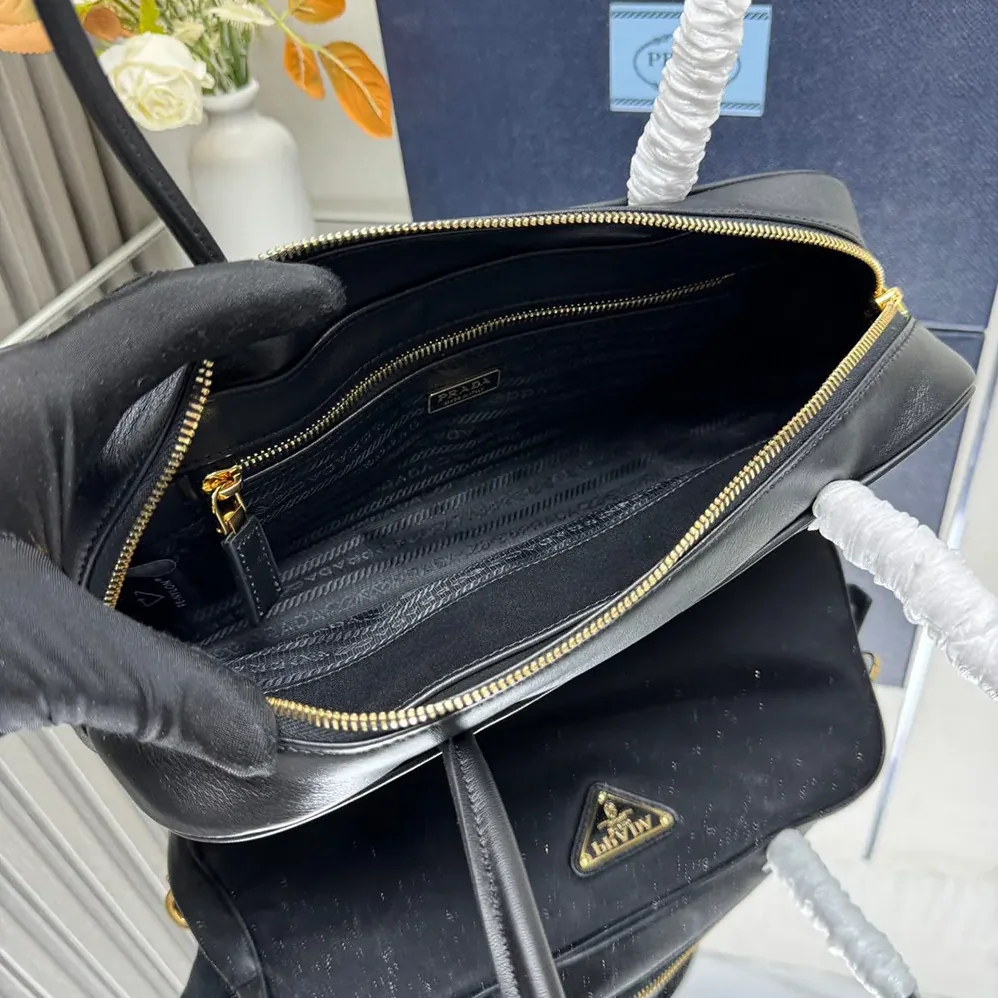 Prada Re-Nylon and Leather Small Top for Women in handle Bag with Padlock Prada Re-Nylon and Leather Small Top for Women in handle Bag with Padlock