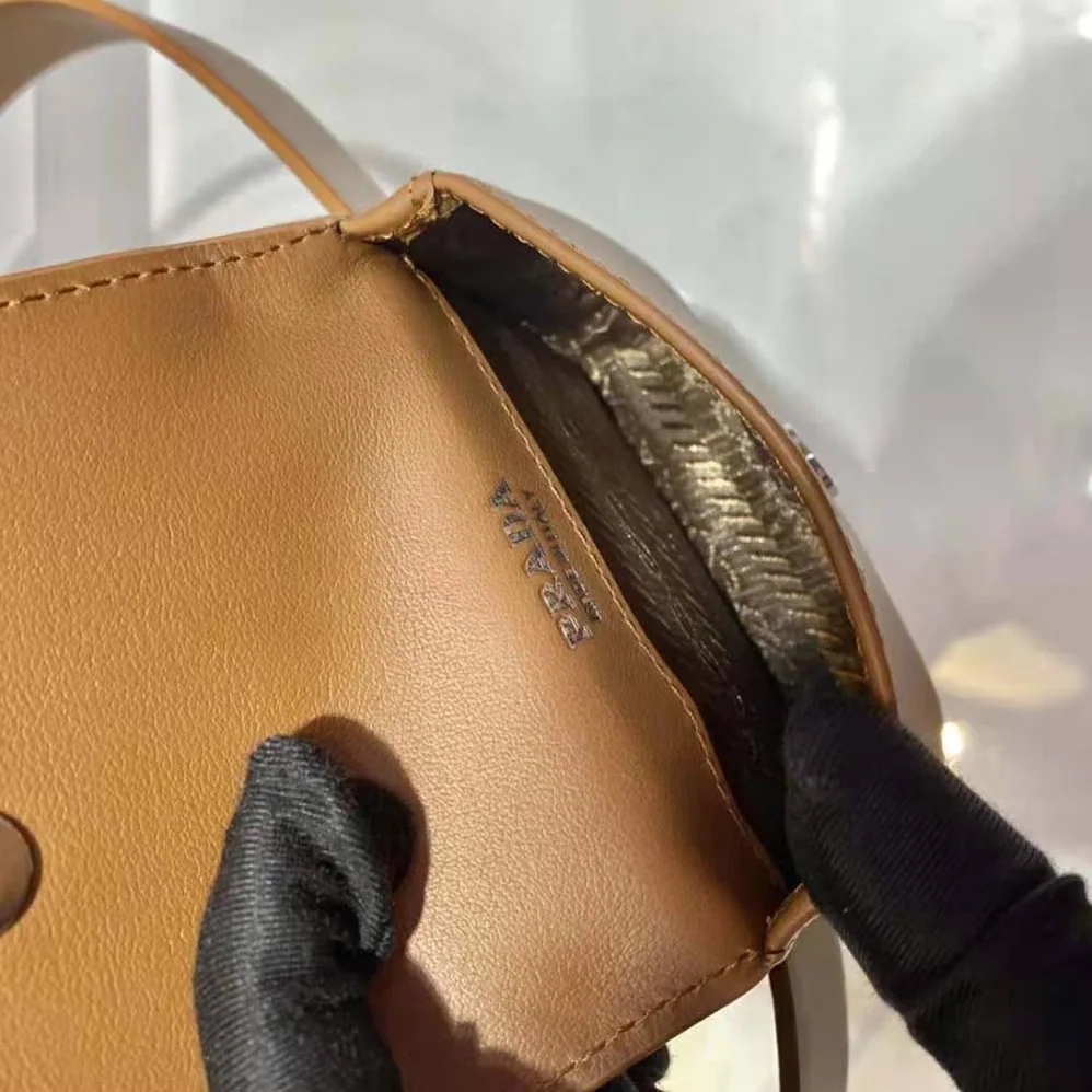 Prada Leather Belt With a Hybrid Multifunctional Design for Women in Brown Prada Leather Belt With a Hybrid Multifunctional Design for Women in Brown