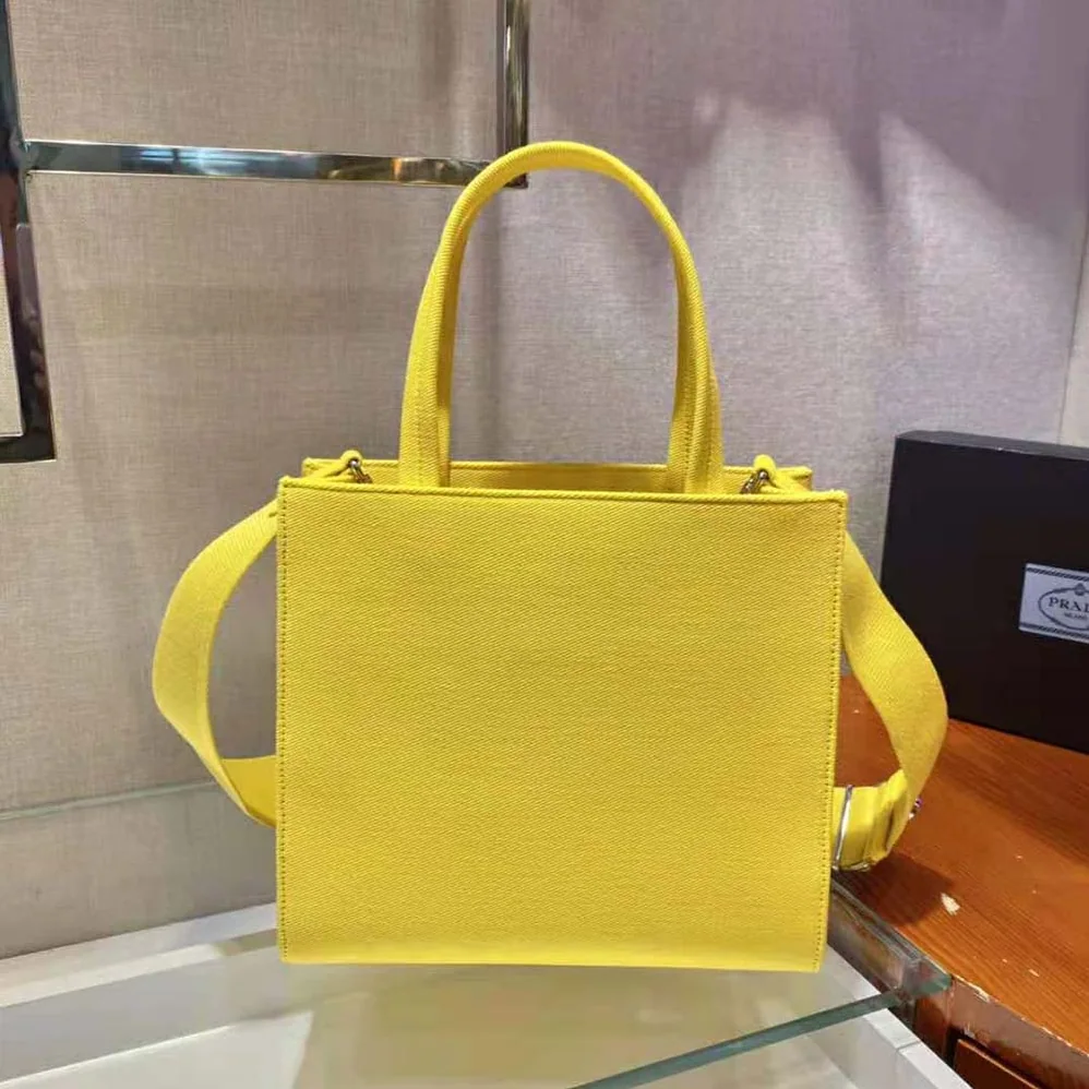 Prada Drill Tote Handles Bag for Women in Yellow Prada Drill Tote Handles Bag for Women in Yellow