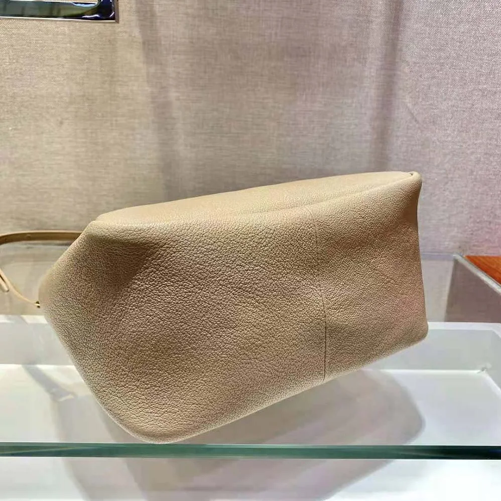 Prada Small leather Handbag with the Prada Metal Lettering Logo Illuminating Its Center for Women in Sandy