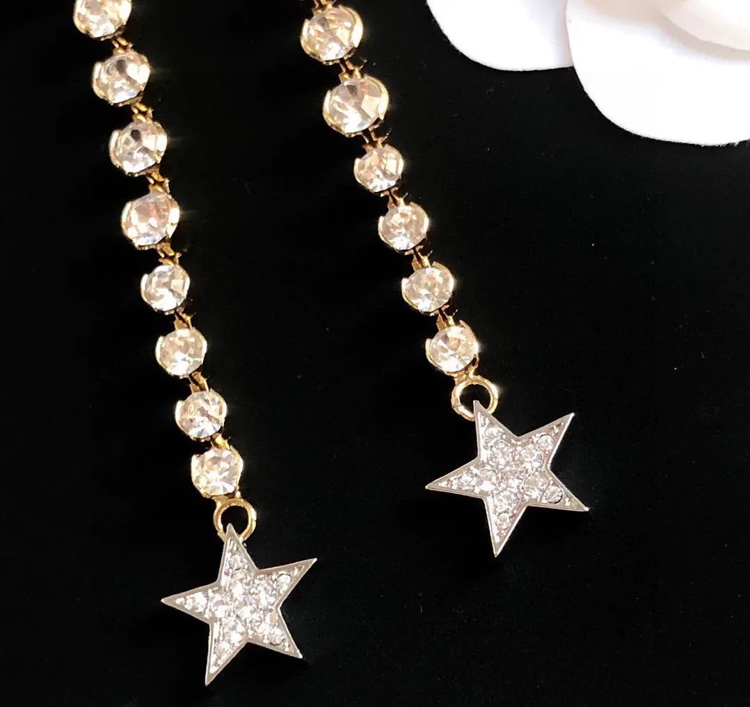 Chanel Long Star Earrings Gold Chanel Long Star Earrings Gold