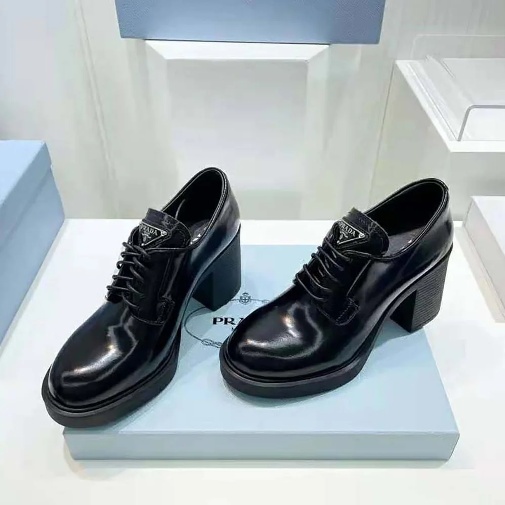 Prada Heeled Brushed Leather Lace-Ups for Women in Black Prada Heeled Brushed Leather Lace-Ups for Women in Black