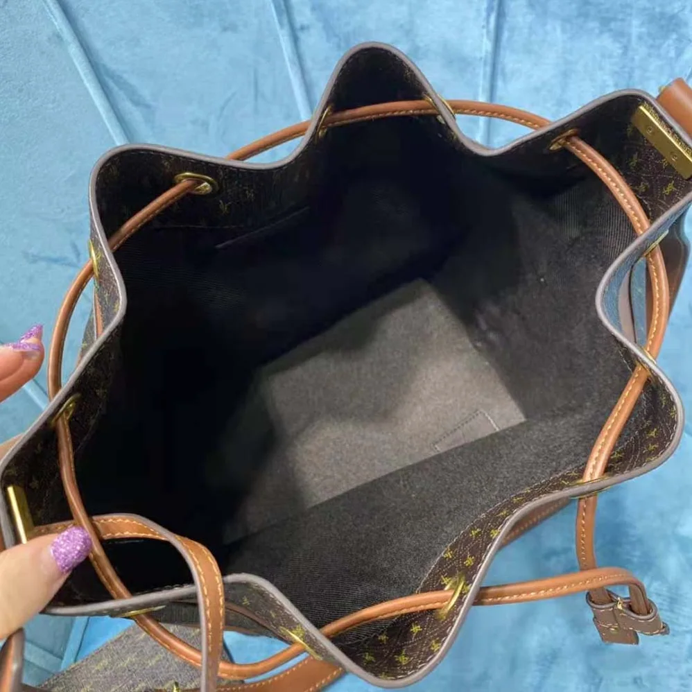 Saint Laurent YSL LE Monogramme Bucket Bag in Canvas and Smooth Leather for Women