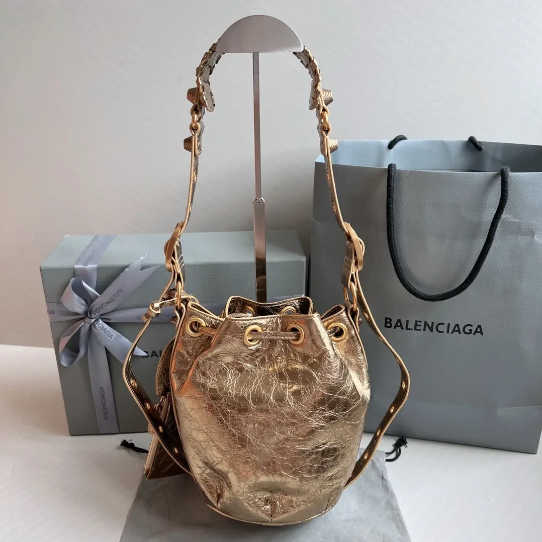 Balenciaga Le Cagole Xs Bucket Bag Metallized With Rhinestones In Gold Tone / Balenciaga Le Cagole Xs Bucket Bag Metallized With Rhinestones In Gold Tone /