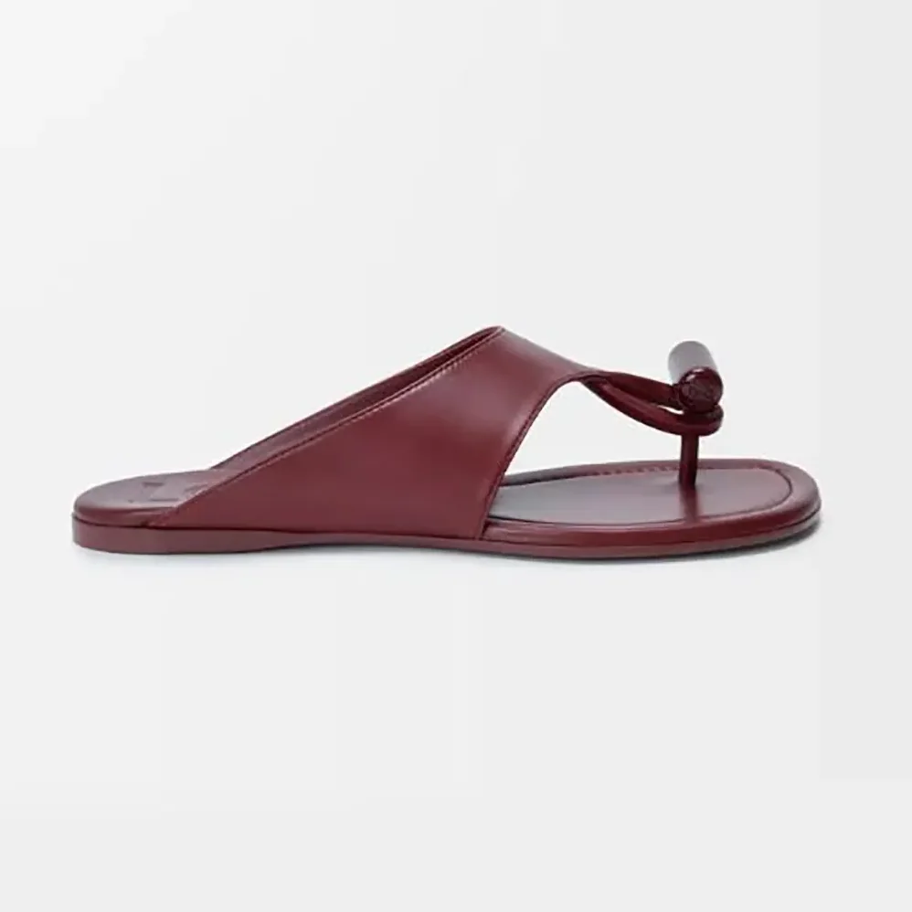 Loewe Toggle Flat Sandal in Shiny Smoot Calfskin for Women in Burnt Red Loewe Toggle Flat Sandal in Shiny Smoot Calfskin for Women in Burnt Red