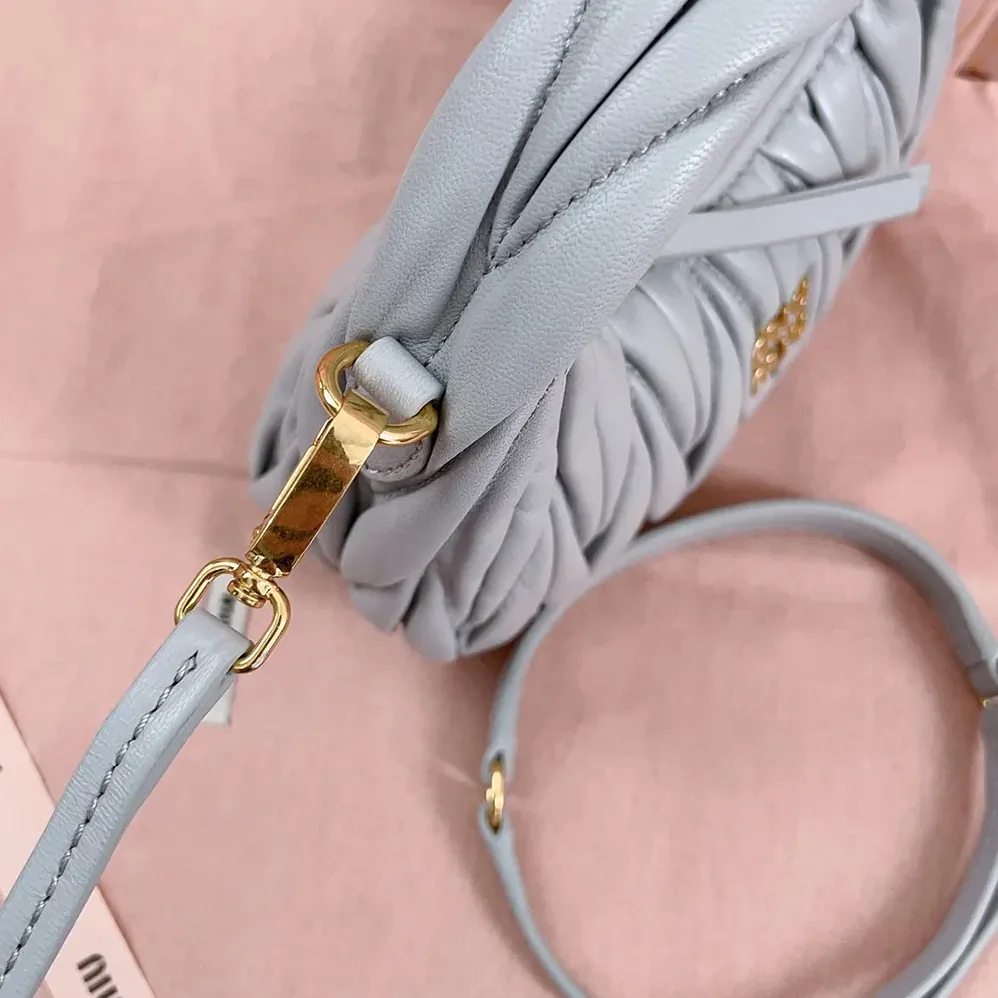 Miu Miu Wander Matelassé Nappa Leather Hobo Mini-Bag for Women in Powder Blue Miu Miu Wander Matelassé Nappa Leather Hobo Mini-Bag for Women in Powder Blue