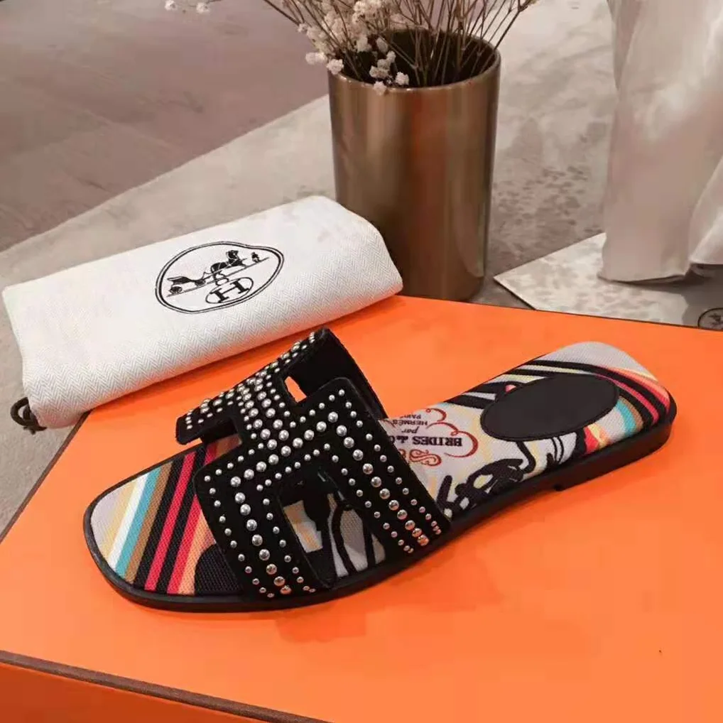 Hermes Oran Sandal in Suede Goatskin with Palladium Plated Studs and Iconic “H” Cut-Out for Women in Black