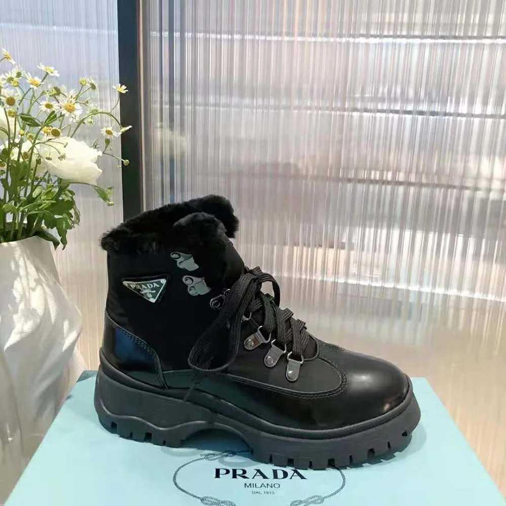 Prada Brixxen Leather and Nylon Booties for Women in Black