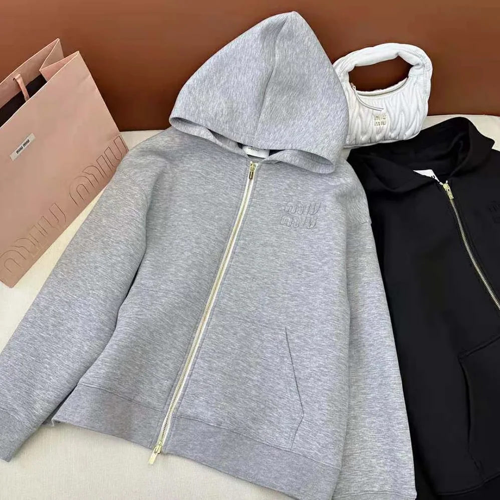 Miu Miu Embroidered Cotton Fleece Hoodie with Embroidered Logo for Women in Silver Miu Miu Embroidered Cotton Fleece Hoodie with Embroidered Logo for Women in Silver