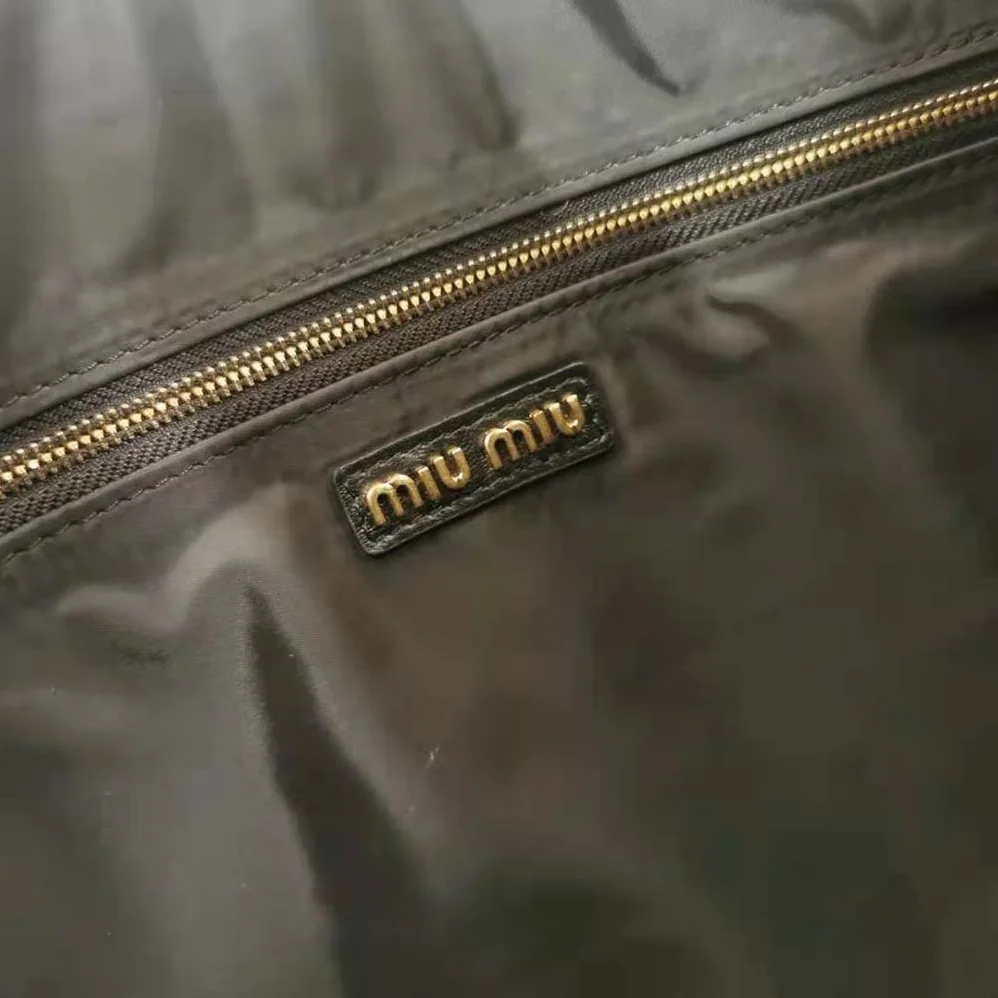 Miu Miu Leather Shoulder Bag with Embossed Lettering Logo on the Front for Women