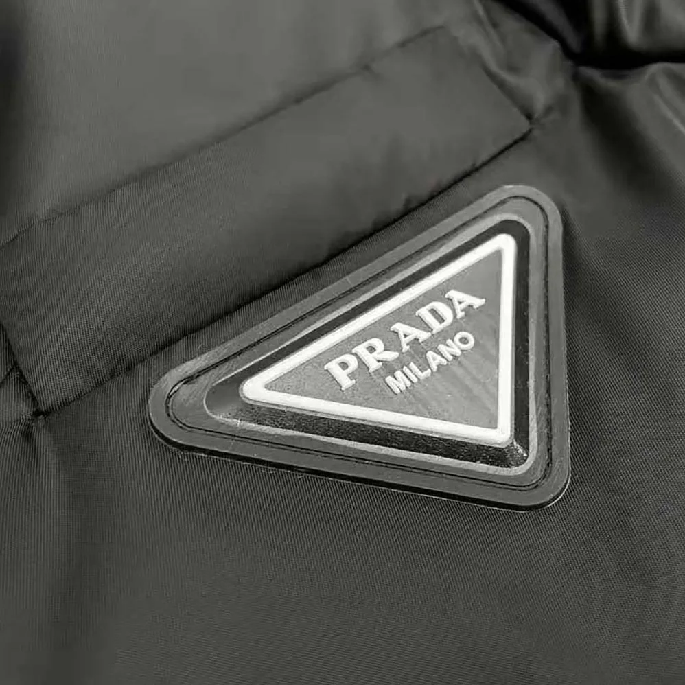Prada Re-Nylon Down Coat with Enameled Metal Triangle Logo for Women Prada Re-Nylon Down Coat with Enameled Metal Triangle Logo for Women