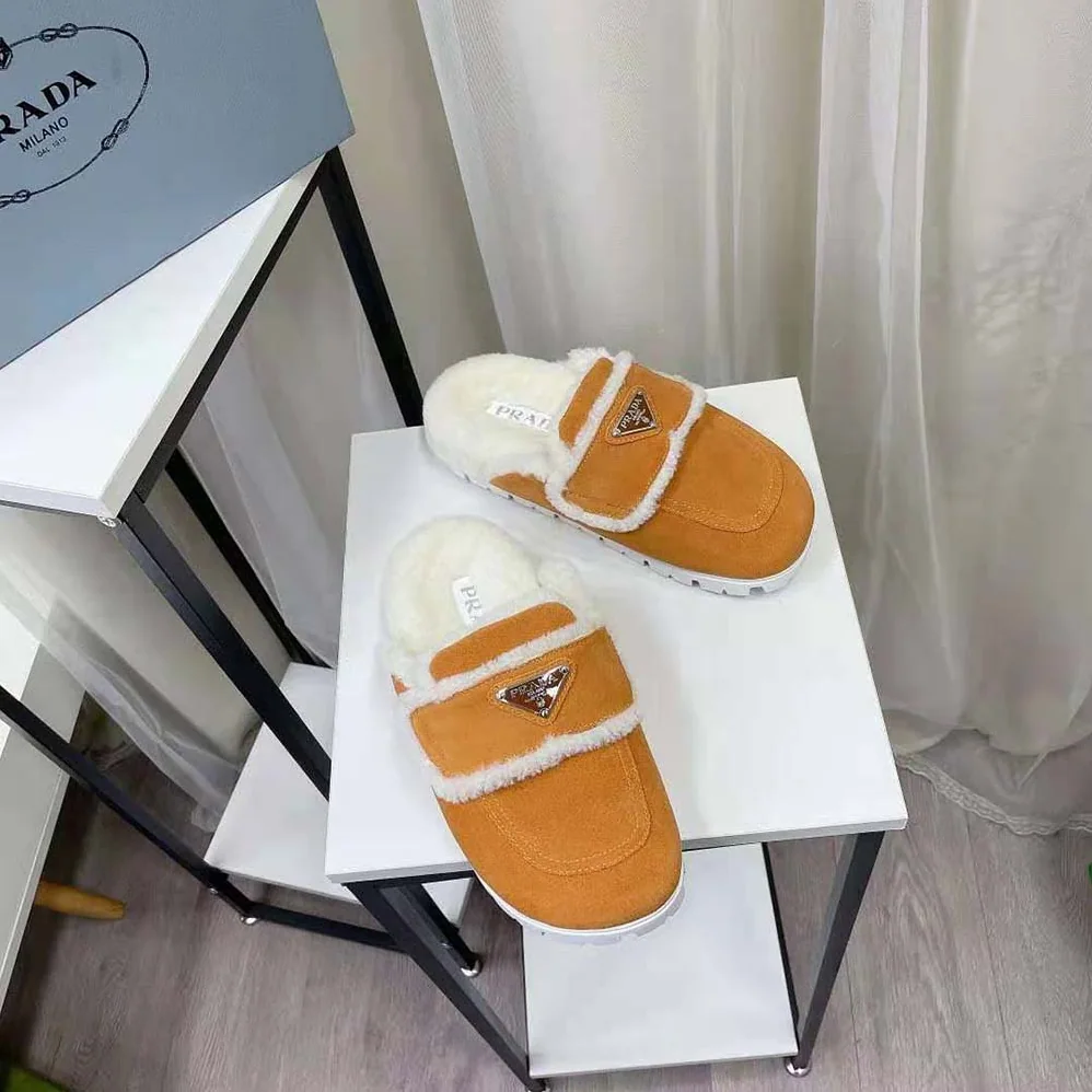 Prada Shearling Slippers Enameled Metal Triangle Logo for Women in Yellow Prada Shearling Slippers Enameled Metal Triangle Logo for Women in Yellow