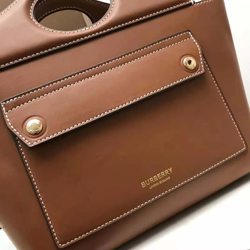 Burberry Mini Leather Soft Pocket Tote for Women in Brown Burberry Mini Leather Soft Pocket Tote for Women in Brown