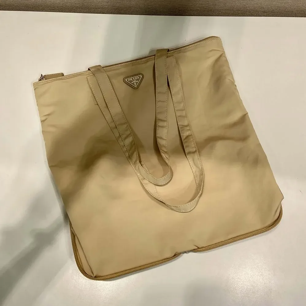 Prada Saffiano Leather Pendant With Re-Nylon Tote Bag for Women in Camel Brown Prada Saffiano Leather Pendant With Re-Nylon Tote Bag for Women in Camel Brown
