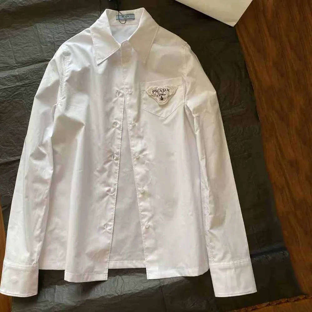 Prada Poplin Shirt Reveals a Complex Simplicity Constantly for Women Prada Poplin Shirt Reveals a Complex Simplicity Constantly for Women