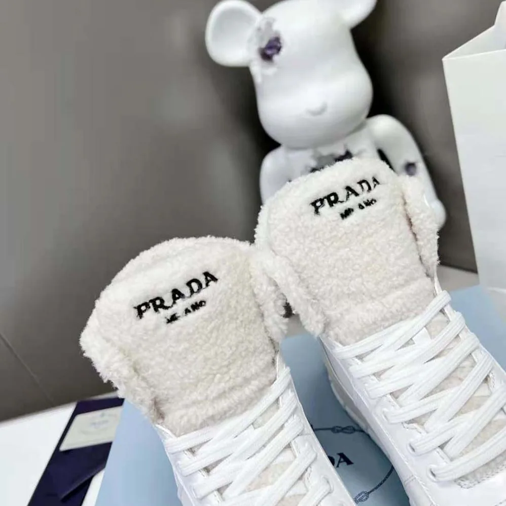 Prada Leather and Shearling High-Top Sneakers for Women in White Prada Leather and Shearling High-Top Sneakers for Women in White