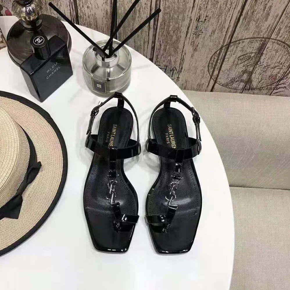 Saint Laurent YSL Cassandra Flat Sandals in Patent Leather with Silver for Women in Tone Monogram