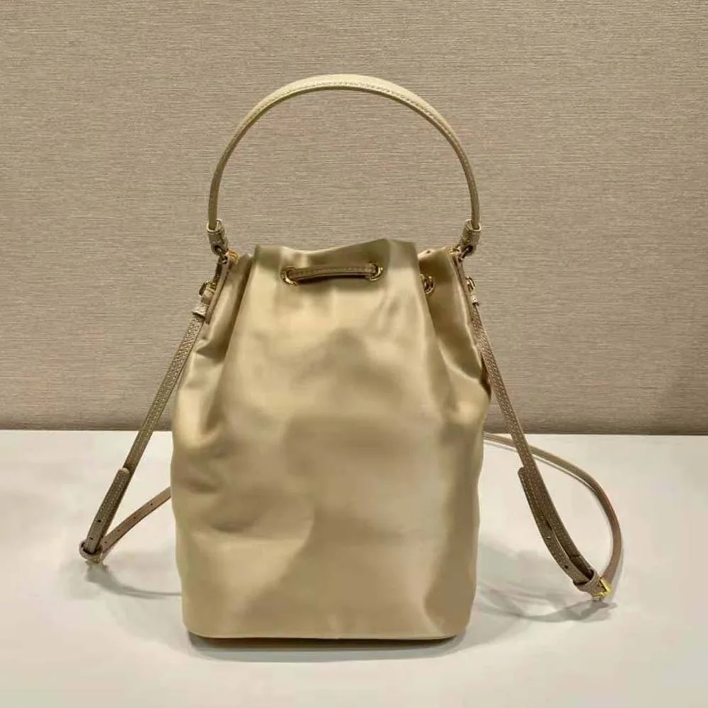 Prada Duet Re-Nylon Bucket Bag for Women in Beige